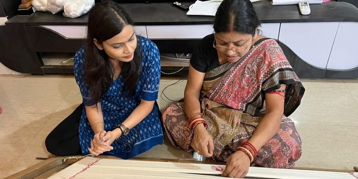 Sukanti Meher weaving Sambalpuri Bandha saree on traditional loom in Barpali Odisha