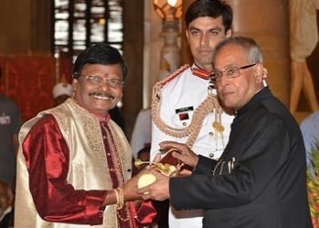 artisans carving stone sculptures at Raghunath Mohapatra workshop Odisha